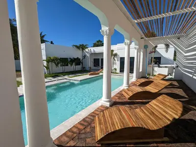 a house with a swimming pool and a porch at CASA ROMA Hotel Boutique in El Tamarindo