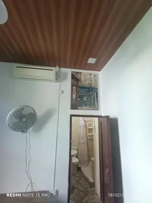 a room with a glass door with a picture on the wall at Casa Vieja Guest House in Santa Ana