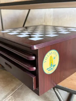 a wooden chess board with a sign on it at 1 Family Pool Villa BBQ PARKING EL SUNZAL Surf City Area in El Sunzal