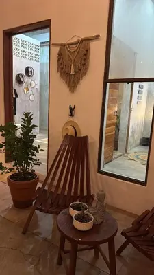 a room with a bench and a table and a window at 3 Family Villa Private Pool Parking BBQ El Sunzal El Tunco El Zonte SURFCITY in Tamanique