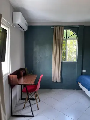a room with a desk and a chair and a window at Habitación cerca del aeropuerto #2 in La Paz