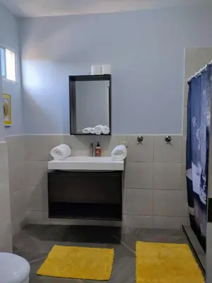 a bathroom with a sink and a mirror at Rancho Del Oso Tuerto in Marcelino
