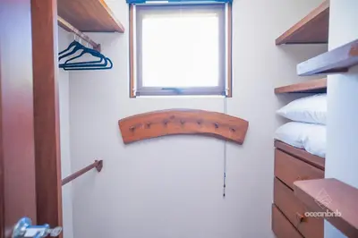 a door in a room with a window and a bed at SantiChanti Walk to Sunzal Beach in Tamanique
