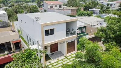 an aerial view of a white house at Family Friendly Guanaco House El Salvador AC, Wi-Fi, Hot Water, & Enjoy Your Stay in Santa Ana
