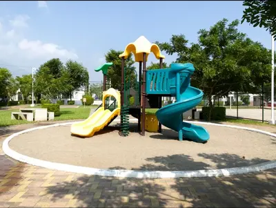 a playground with a slide in a park at Disfruta y siéntete como en casa in San Miguel