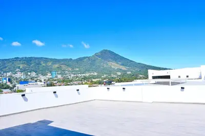 a view of a city from the roof of a building at Modern Apartment in Downtown. A/C+ Wifi! in San Salvador