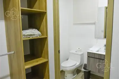 a small bathroom with a toilet and a sink at The Downtown Apartment - 3 A/C bedroom + WiFi in San Salvador