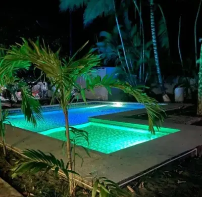 a swimming pool in a resort at night at Cielo Azul in La Libertad