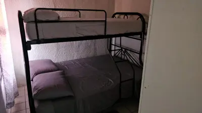 a couple of bunk beds in a room at Buena Vista Home in Nueva San Salvador