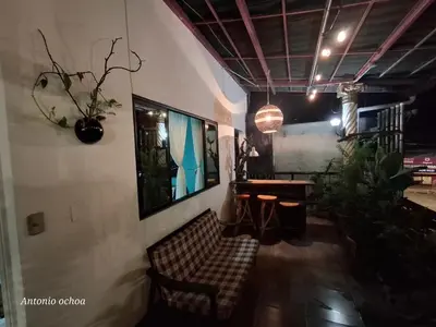 a living room with a couch and a table at Casaca in Concepción de Ataco