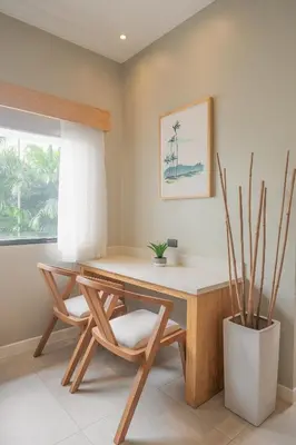 a desk with a chair in a room with a window at Mirasurf Hotel & Waves in El Sunzal