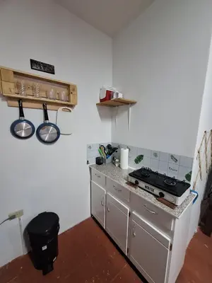 a kitchen with a stove and a counter top at Coastal Paradise Estudio Cerca de Sunset Park y Playa in La Libertad