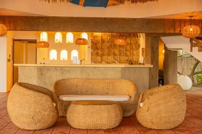 a lobby with two chairs and a table at The rooftop Beach & club in La Libertad