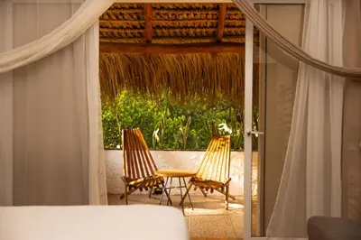 two chairs and a table on a patio at The rooftop Beach & club in La Libertad