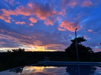 a view of a sunset with a sky at Rancho Agua Fria casa in Usulután