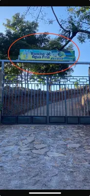 a fence with a sign on top of it at Rancho Agua Fria casa in Usulután