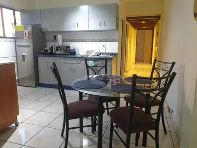 a kitchen with a table and chairs in a room at Isabela´s Quality Accommodation in San Salvador