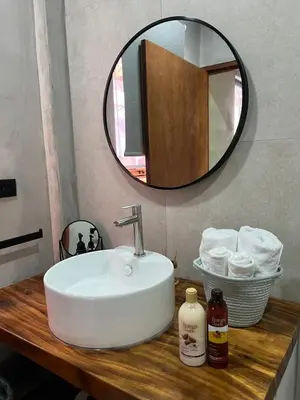 a bathroom with a sink and a mirror at Shalpabay - Rooms in Taquillo