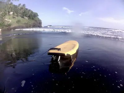 a boat in the water on a beach at Shalpabay House in Taquillo