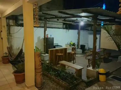 a room with a desk and a table and some plants at Equiped cozy Room for rent! in La Libertad