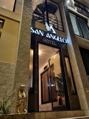 a building with a sign for a san angelo hotel at Hotel San Angelo in Concepción de Ataco