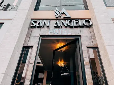 a sign on the front of a building at Hotel San Angelo in Concepción de Ataco