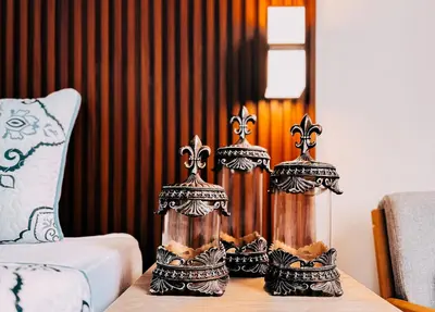 two candles on a table in a room at Hotel San Angelo in Concepción de Ataco