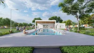 a swimming pool in a park with people around it at Casa Málaga en San Miguel, El Salvador in San Miguel