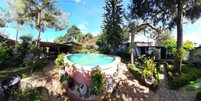 a garden with a large pool in a yard at San Fernando in Concepción de Ataco