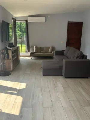 a living room with a couch and a table at Quinta Temiki in San Pedro Masahuat