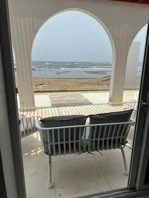 a bench sitting in front of a window at Mariposa Reina A in El Tamarindo