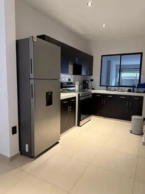 a kitchen with a stainless steel refrigerator in it at New home in Santa Ana in Santa Ana
