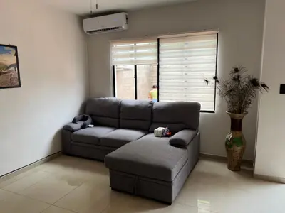a living room with a couch and a chair at New home in Santa Ana in Santa Ana