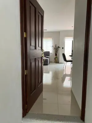 an open door to a room with a living room at New home in Santa Ana in Santa Ana