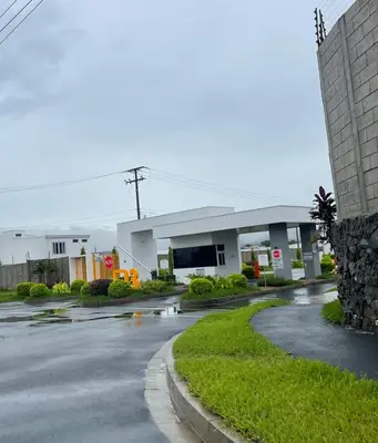 a gas station with a road in front of it at Gabby House in Sitio del Niño