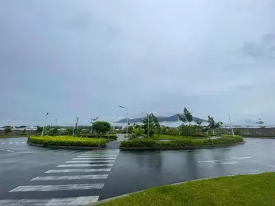 a wet road with a crosswalk in the middle at Gabby House in Sitio del Niño