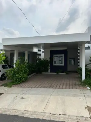 a house with a parking lot in front of it at Gabby House in Sitio del Niño