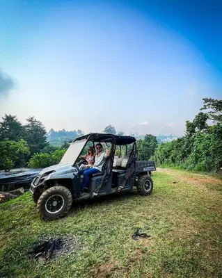 a group of people riding in a jeep in a field at Hotel y Restaurante Alicante de Montaña, El Salvador in Los Tablones