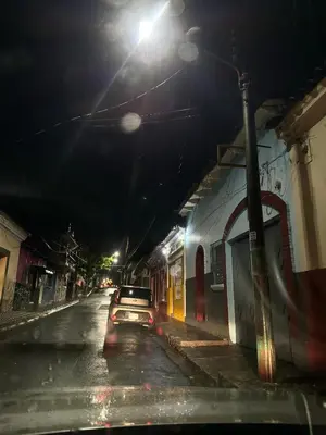 a car parked on the side of a street at night at Santa Ana, Close to Cathedral in Santa Ana