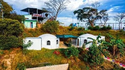 a house on a hill with white domes at Las Terrazas de el Alto in Chalatenango