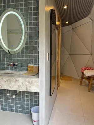 a bathroom with a mirror and a sink at Almare Zonte - BeachFront Glamping Hotel in El Zonte