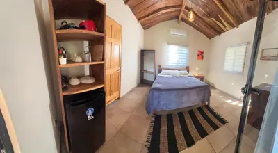 a bedroom with a bed in a room at Surf Lodge El Carrizal-Punta Mango in La Periquera