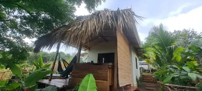 a small hut with a thatched roof at Surf Lodge El Carrizal-Punta Mango in La Periquera