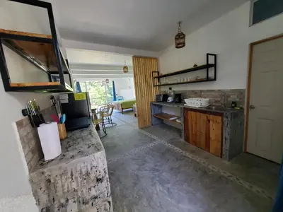 a kitchen with a sink and a counter top at Wayo loft en Playa El Tunco Surf City in Tamanique