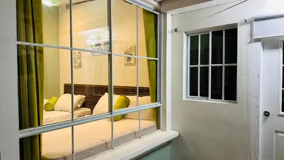 a room with a window with a couch in it at Muy cerca de playas y miradores muy accesible a la ciudad y comercios in La Unión