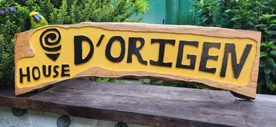 a wooden sign that reads a house houseruck at D Origen House APANECA in Apaneca