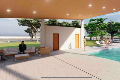 a man sitting on a couch next to a pool at Tiny but cozy home in Santa Ana in Santa Ana