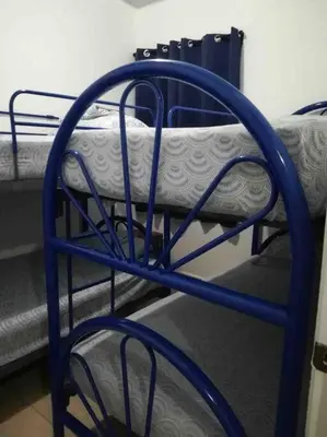 a blue bunk bed with a mattress on it at Tiny but cozy home in Santa Ana in Santa Ana
