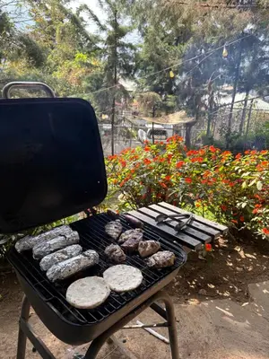 a grill with a bunch of food on it at Cabaña privada en Los Naranjos in Los Naranjos
