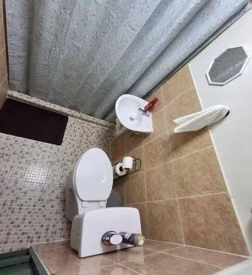 a small bathroom with a toilet and a sink at Casa Centro Histórico Santa Ana in Santa Ana